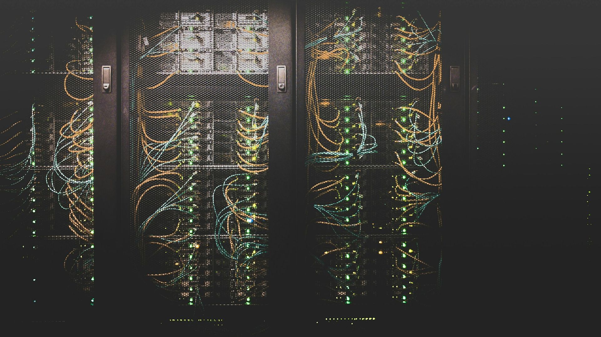 Bundled server and networking cables inside a data center rack.