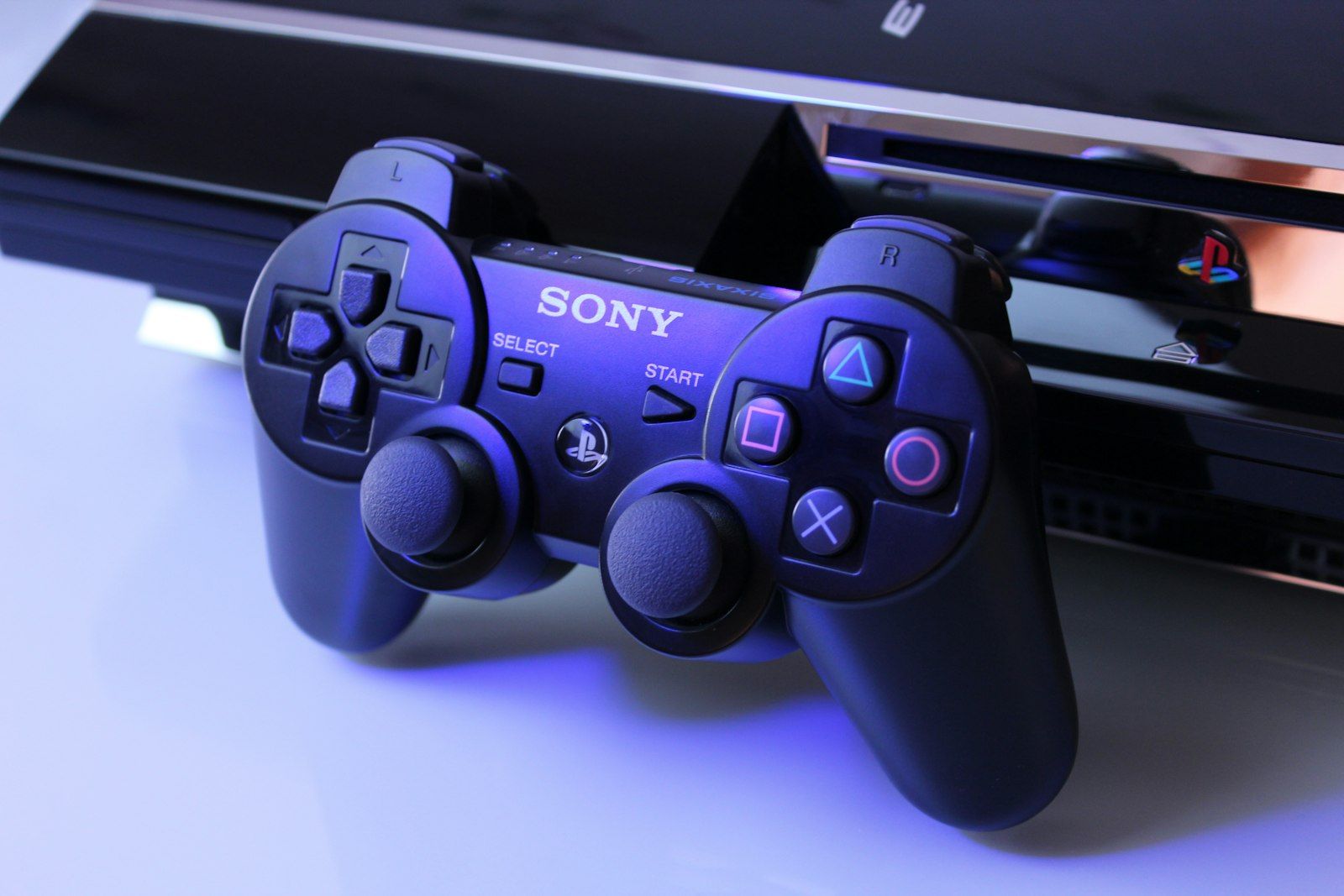 A black PlayStation game controller, the platform Kingdom Hearts, Kingdom Hearts II, and most of the franchise's remasters launched on.